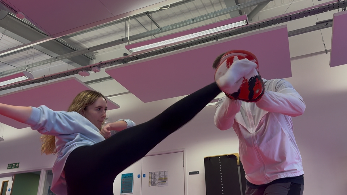 Students sowing of her kickboxing skills at Chatterboxing class